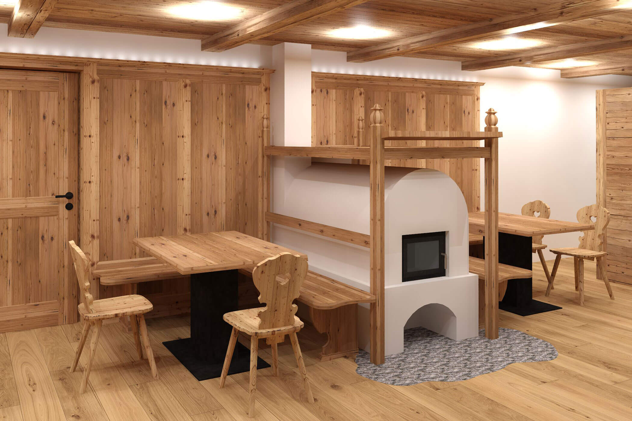 Lounge with tables and chairs and a wood-burning stove - Kuenzerhof